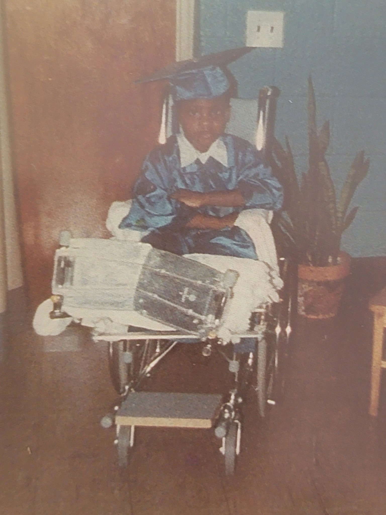 Young KC Capers in graduation cap — the beginning of the story